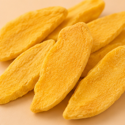 Yellow Freeze Dried Mango slices on a beige background
