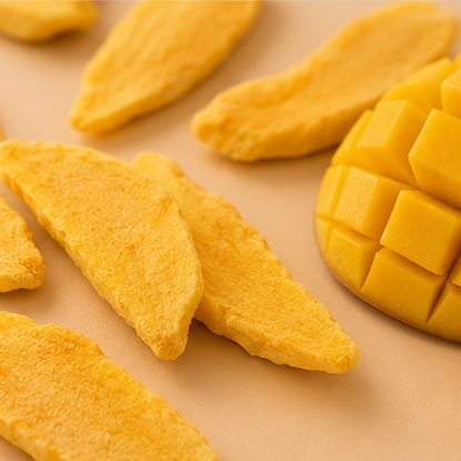 Mango slices and a whole mango on a beige background